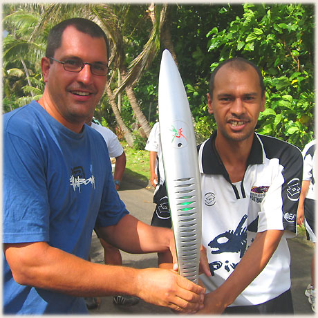A carrier in the Queen’s Baton Relay in Rarotonga on 12 th January 2006 was happy to allow onlookers the chance to briefly touch the baton, including Sokala guest Thomas.
